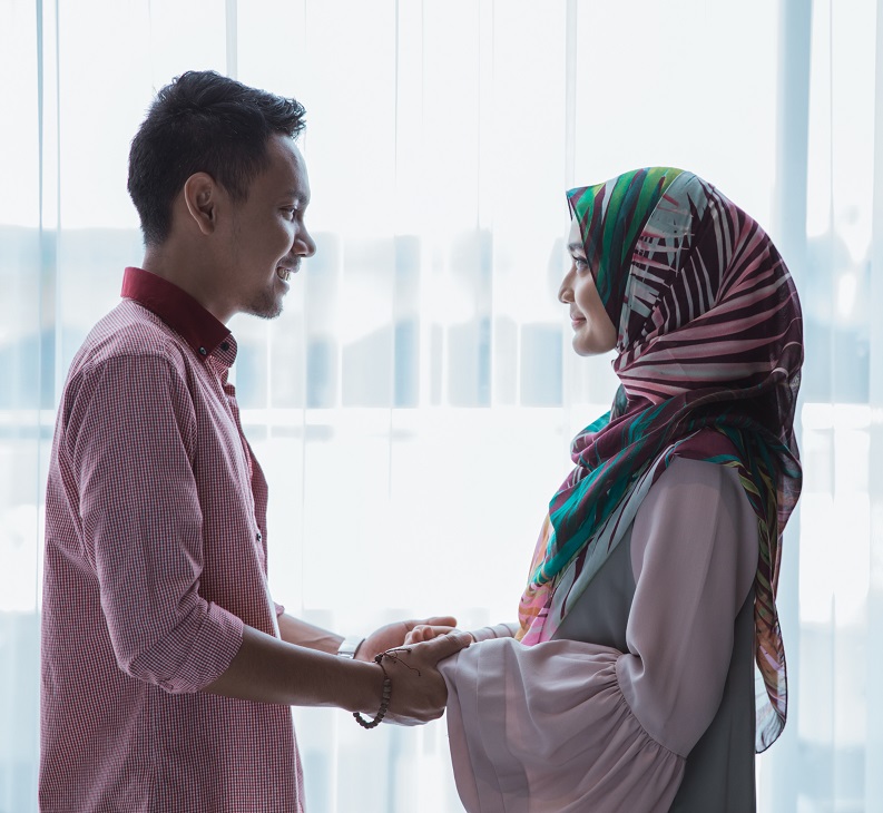 romantic muslim couple holding hands